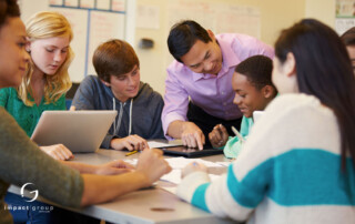 A group of diverse students engaged in collaborative learning with a mentor, highlighting leadership and communication strategies.